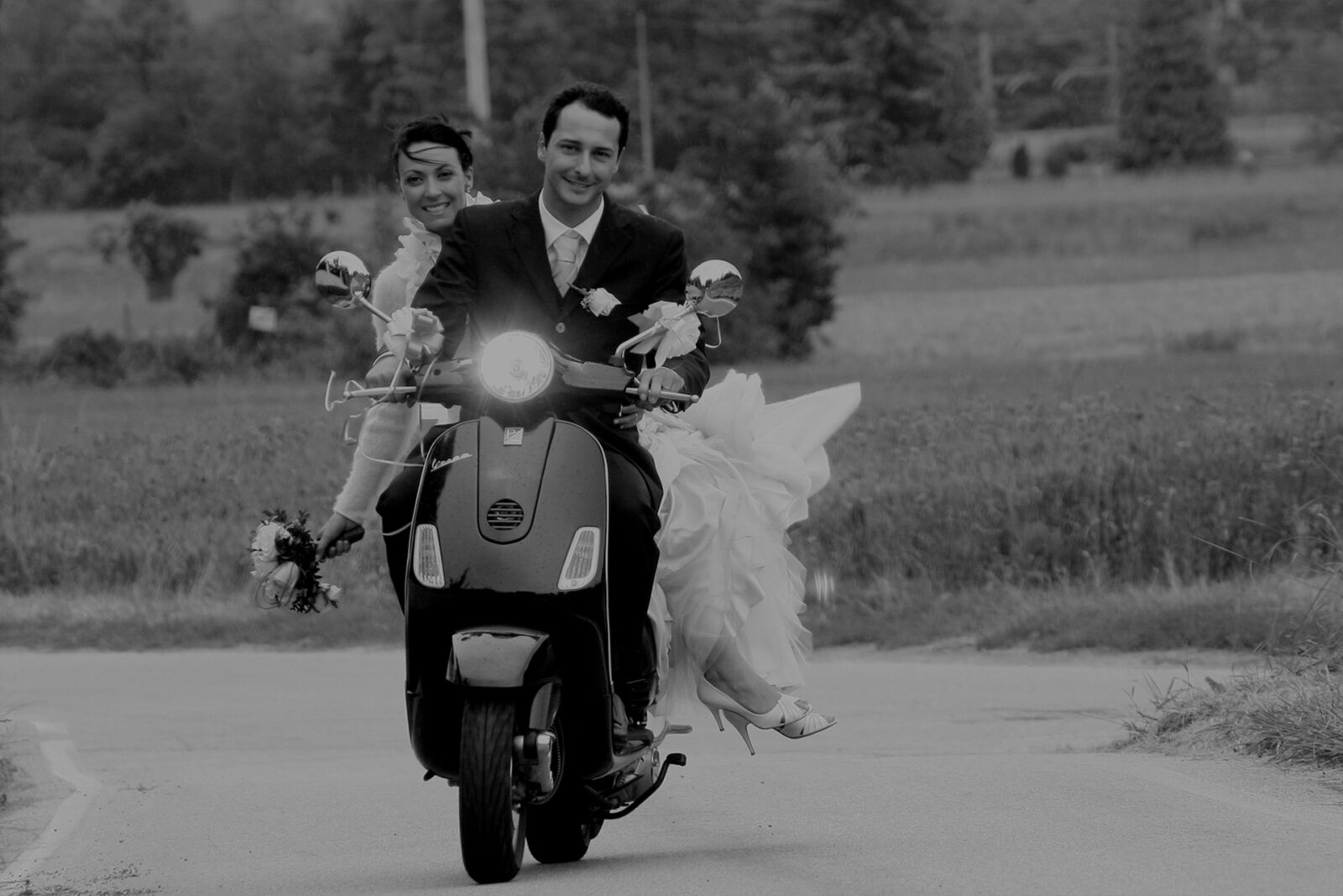 elope in Italy driving a vespa