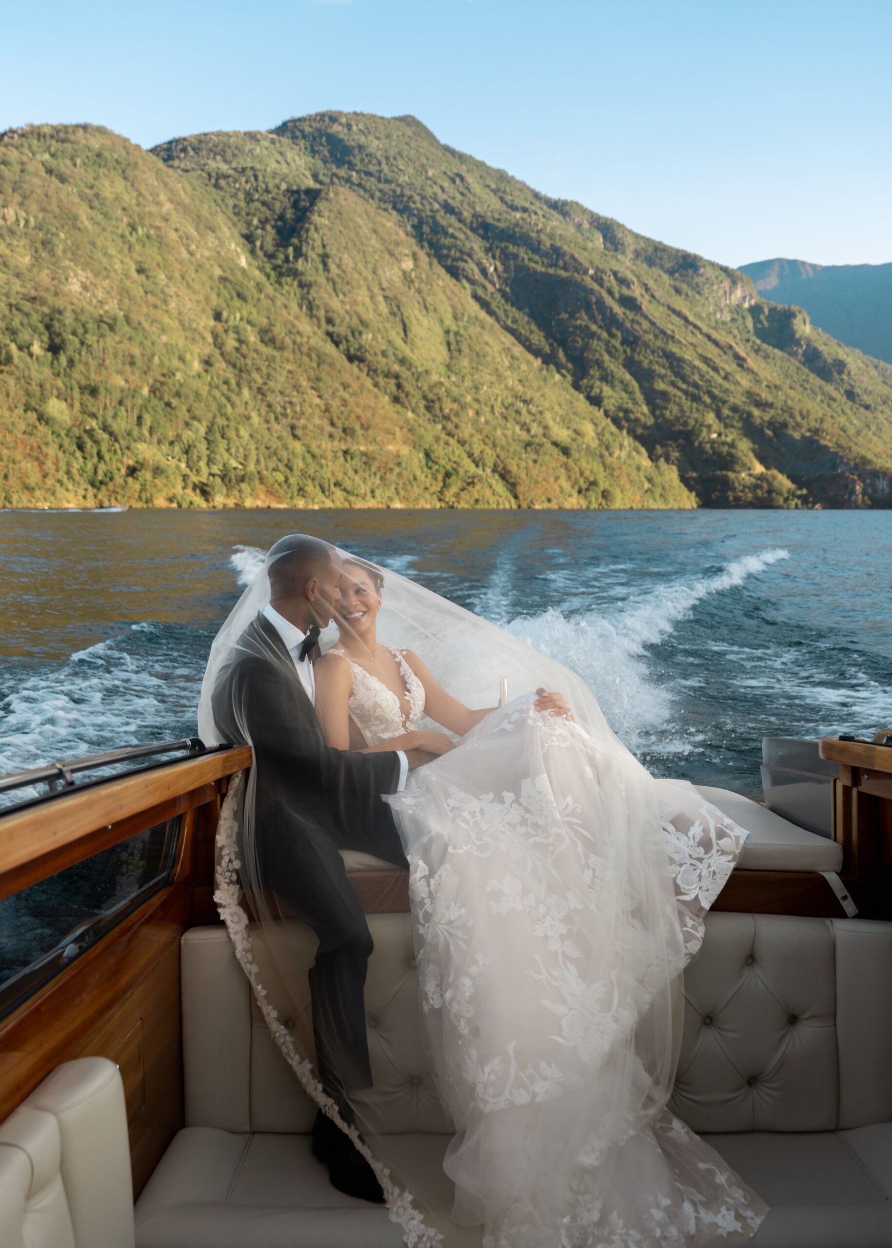 Couple on private sunset boat experience during lake como micro wedding at Villa Carlotta