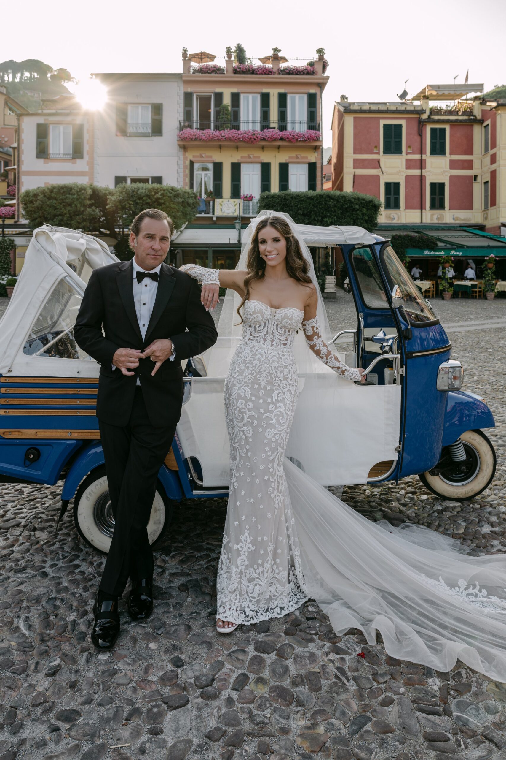 Couple with Ape Calessino at Portofino piazzetta during their glamorous portofino elopement