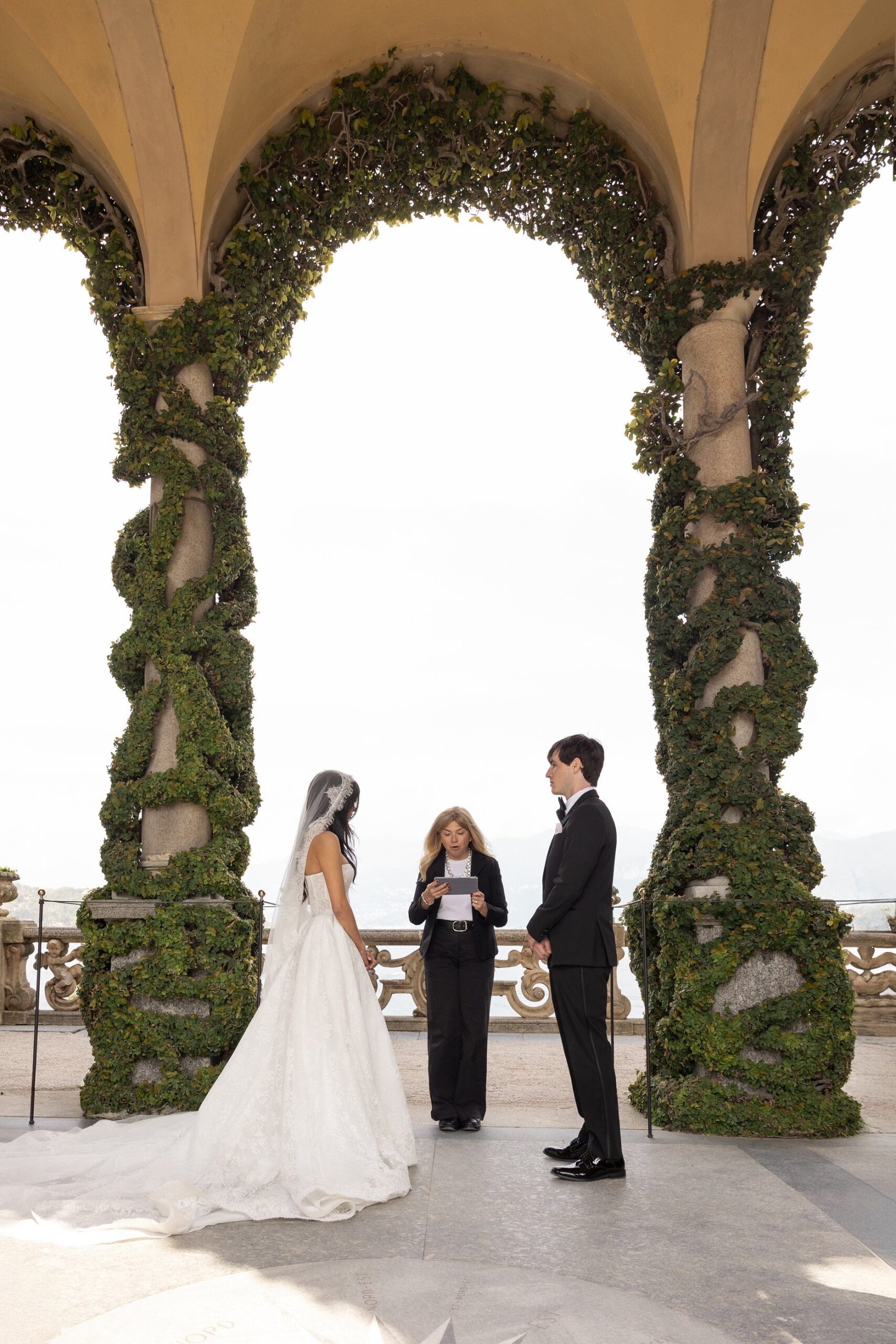 Bride and groom at the panoramic loggia of Villa del Balbianello during their lake como micro wedding